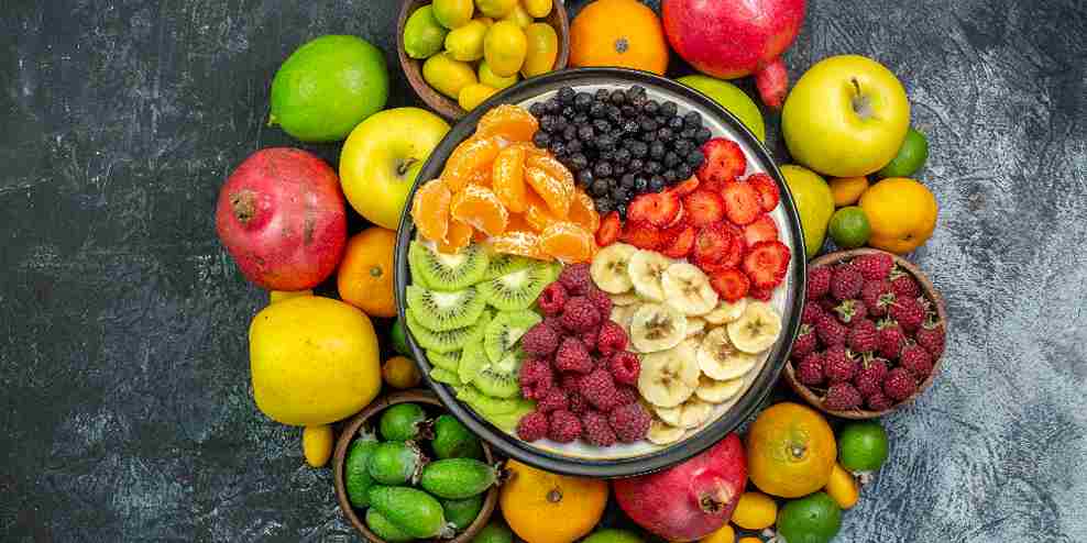 many types of fruits lying on the floor