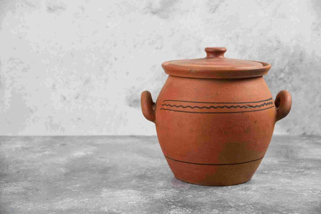 a clay pot to store drinking water