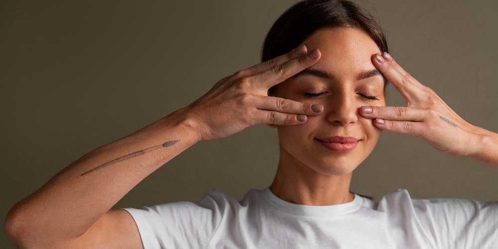 a girl doing under-eye bags massage